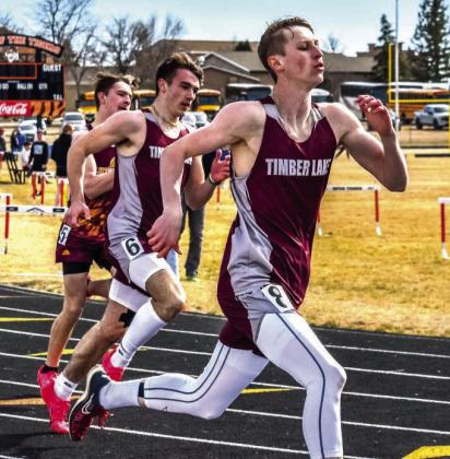 Panther sprinters Holden Gill (right) and Gavin Farlee (center) squared off against one another in recent track action. Farlee, a junior, claimed top honors in the 200 meter run and was third in the 100 meter race at the Northern Hills Invitational last week. Photo by Marie Du Preez